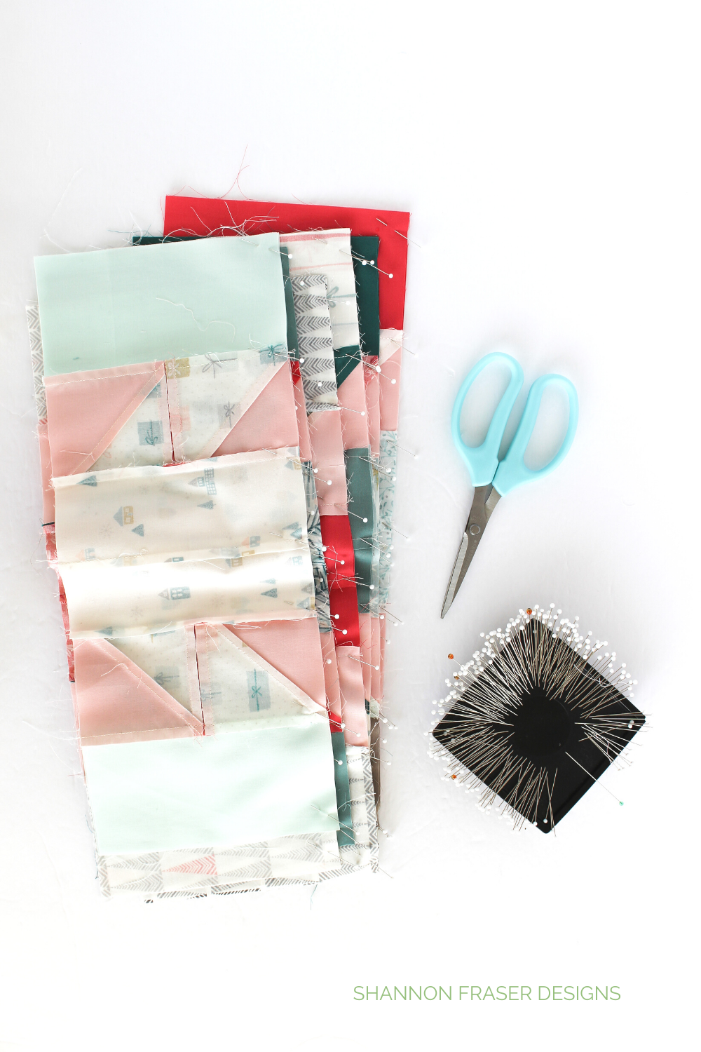 Pinned Shattered Star quilt blocks ready to be chain pieced | Shattered Star Quilt Along Week 6: How to piece your quilt top | Shannon Fraser Designs #quiltblocks