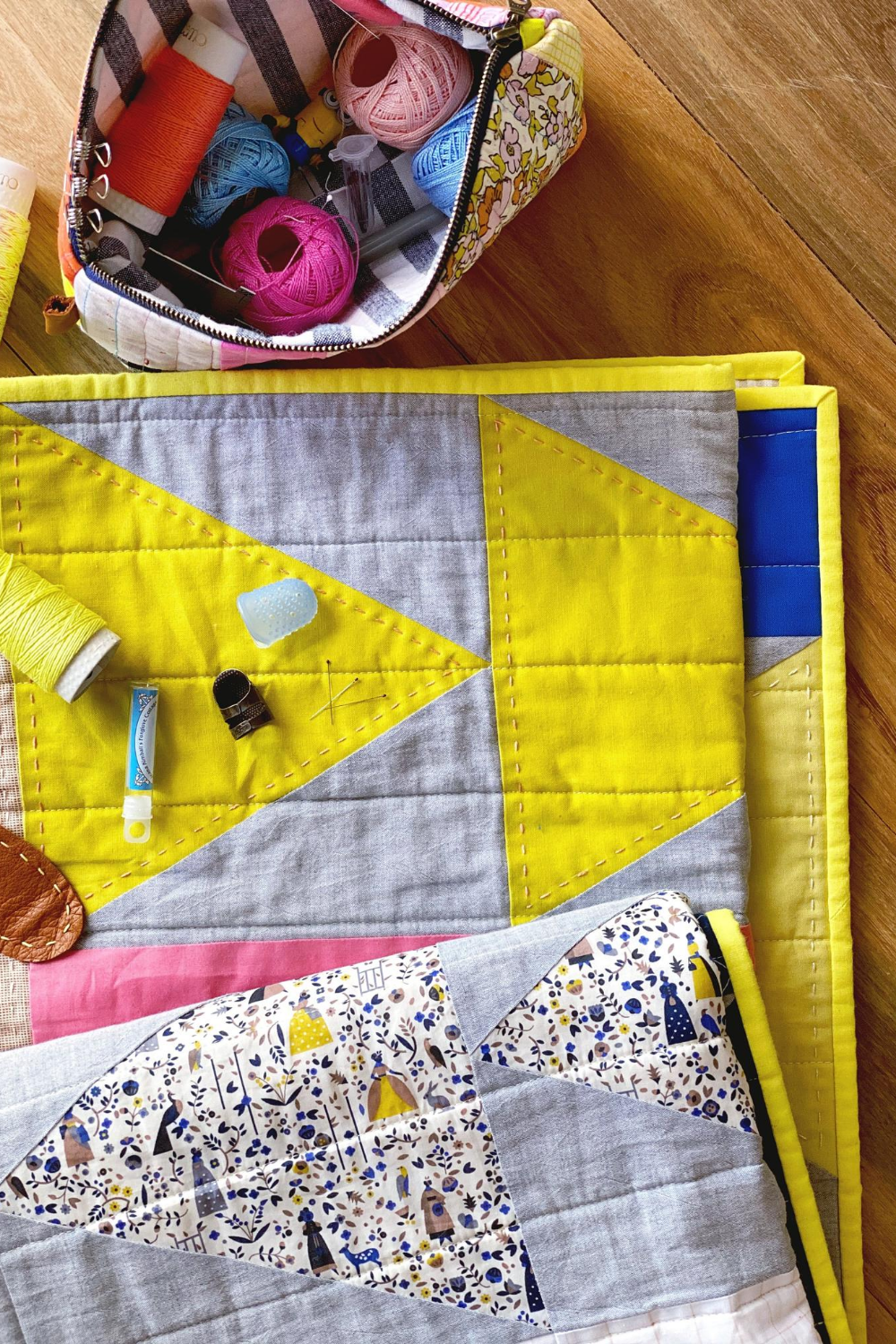 Yellow, gray and blue Flight Plan quilt hand quilted by Flip | What's in Your Sewing Bag Flip? | Shannon Fraser Designs #moderntrianglequilt