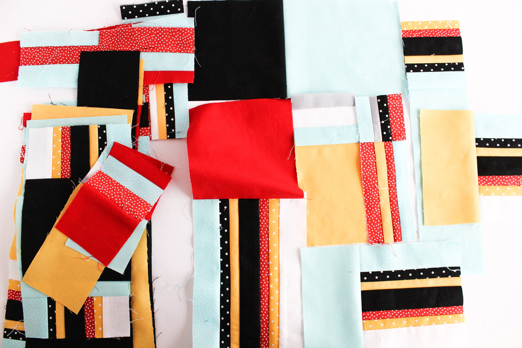 Scrappy fabric strip sets cut into various sizes