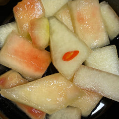 Pickled watermelon rinds served at parties