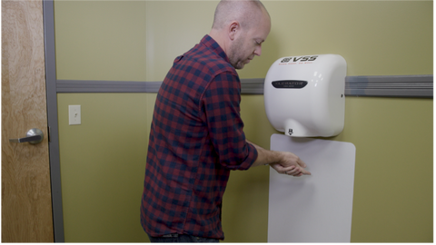 A Man Drying Hands Under XLERATOR Hand Dryer