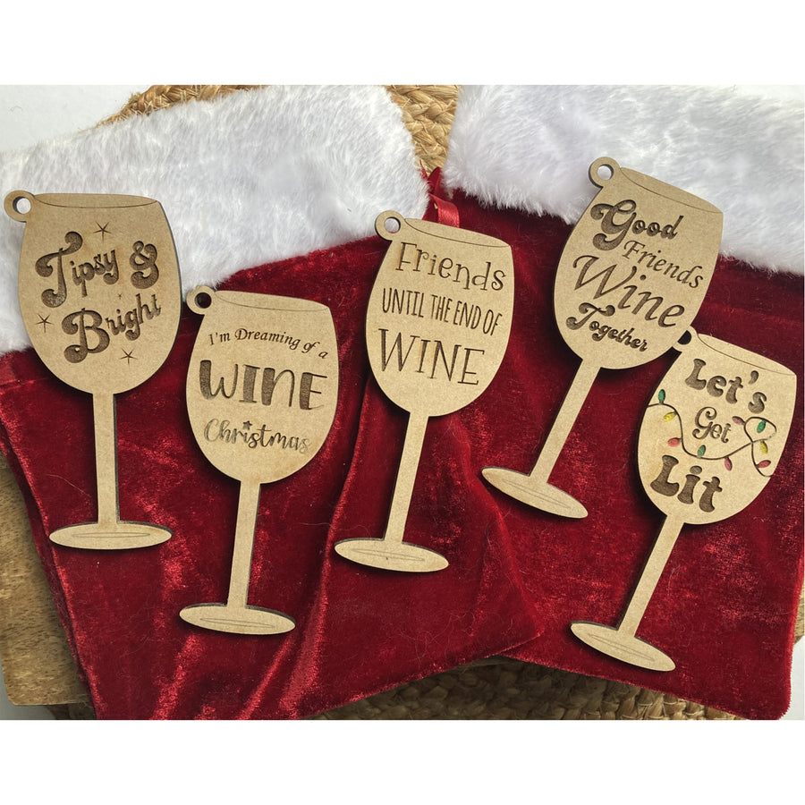 https://cdn.shopify.com/s/files/1/0017/2231/8946/files/HolidayWineGlassOrnament-1square_348806d6-37a0-4663-88fa-d1cf8646074a_900x.jpg?v=1695296536