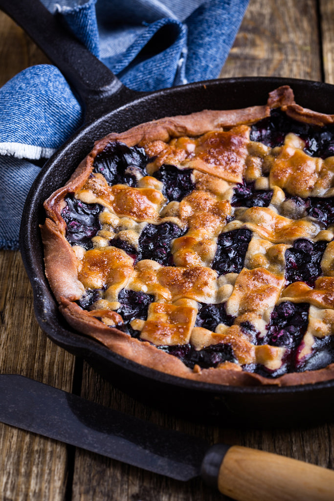 blueberry pie served in a cast iron skillet