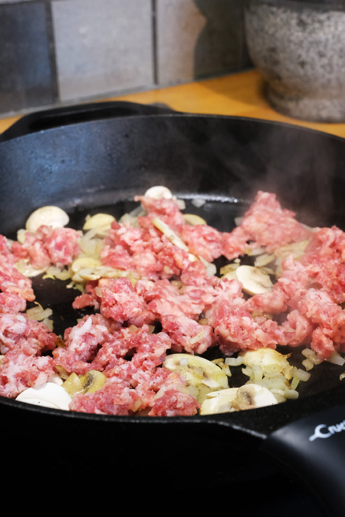 Frying Salsiccia, onion and mushrooms