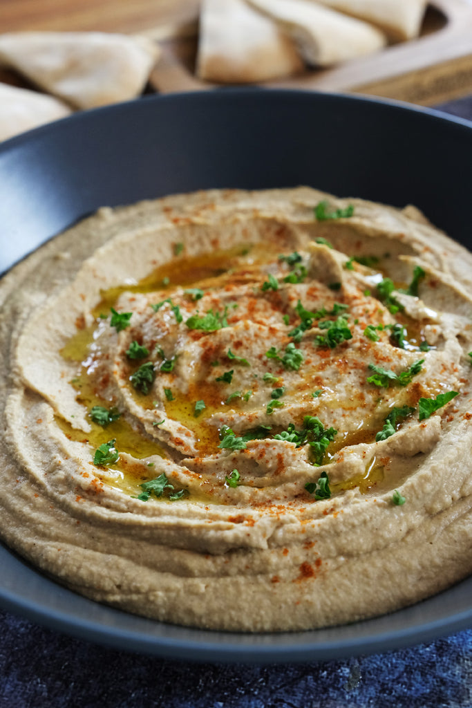 hummus garnished with paprika and parsley