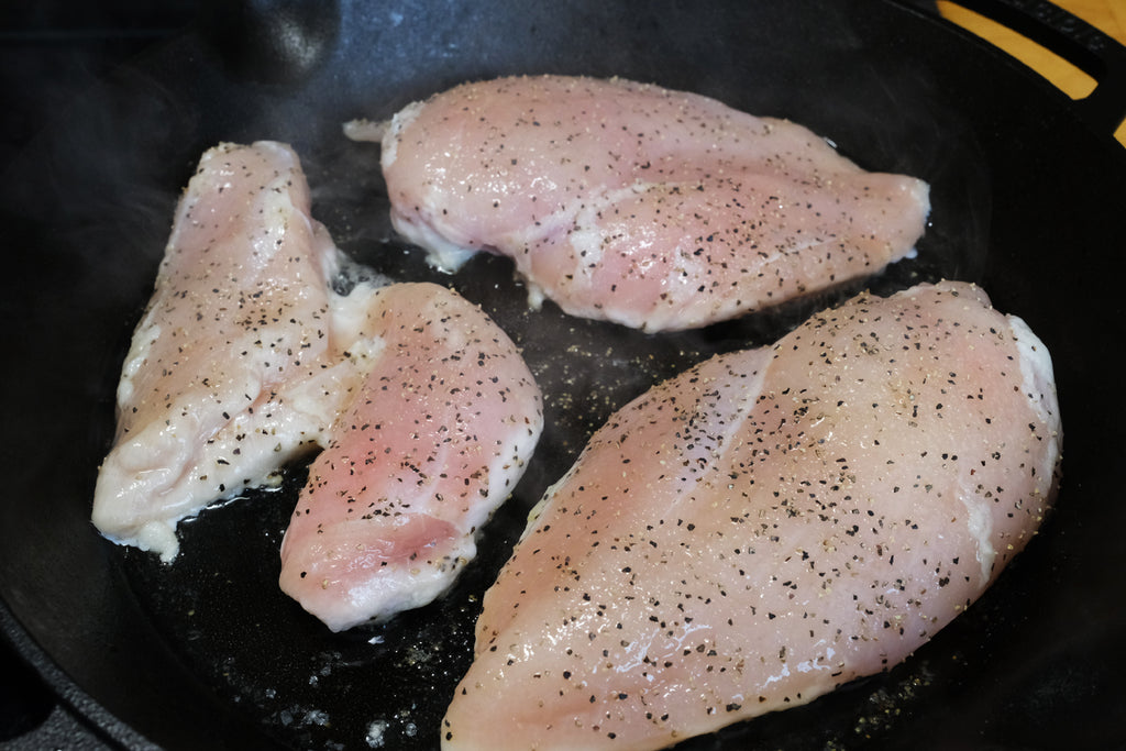 chicken in a 12 inch cast iron skillet with loop handles