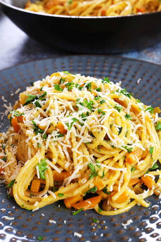 pasta soffritto topped with parsley and parmesan cheese