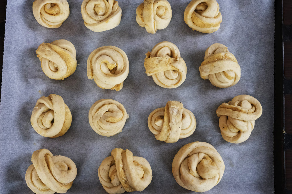 cardamom buns on an oven tray