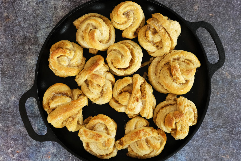 Swedish Cardamom Buns on a cast iron pizza pan