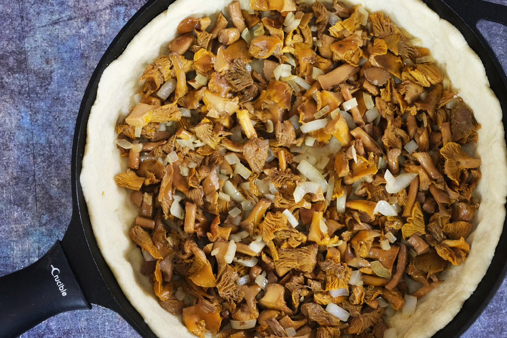 pie crust filled with chantarelle and onion