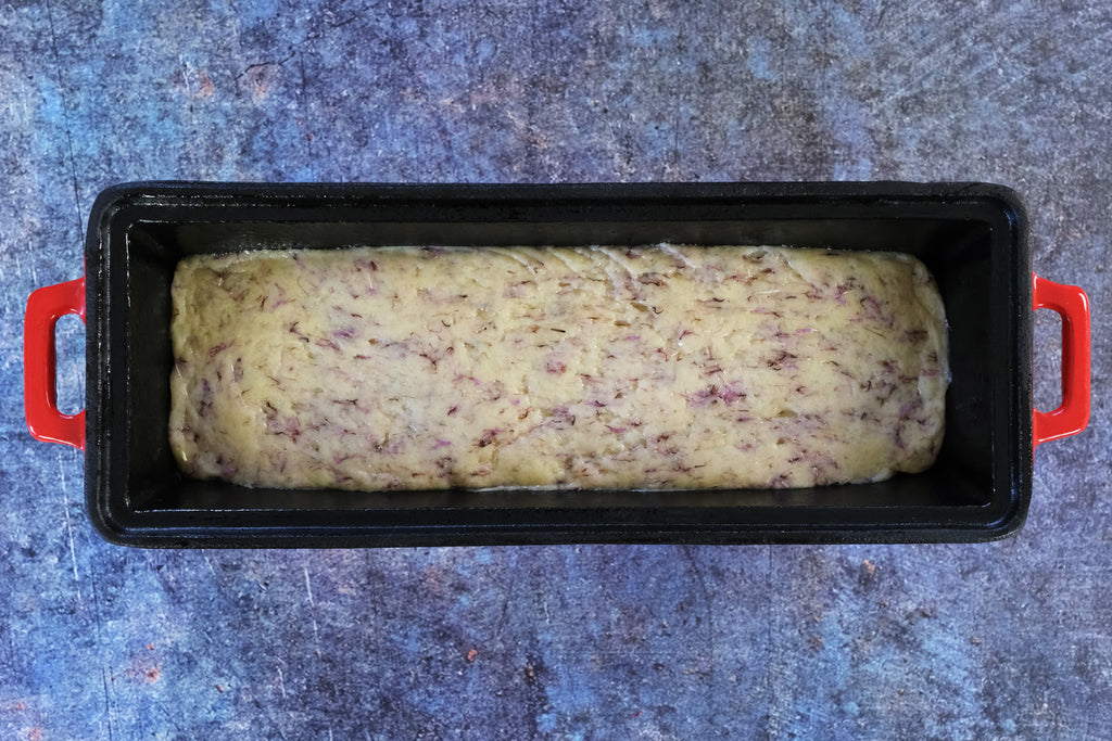 the dough in an enameled cast iron bread pan