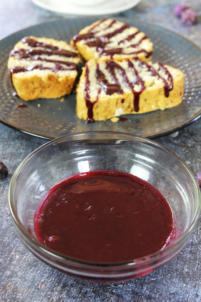 blueberry glaze drizzled on top of cake