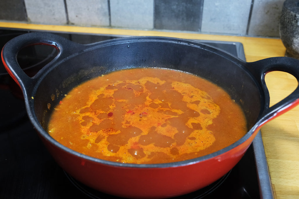 enameled cast iron balti dish on the stove