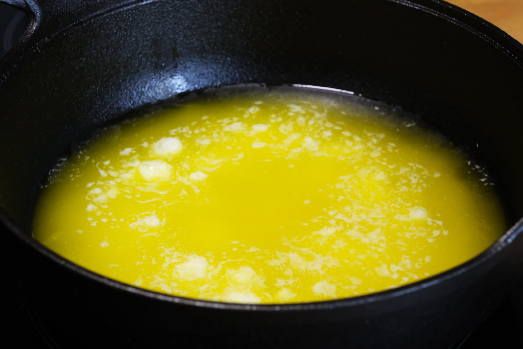 simmering butter in a cast iron balti dish