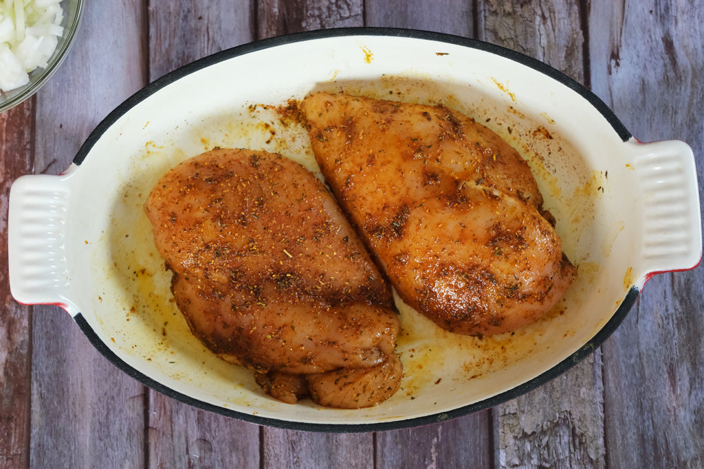 chicken in an enameled cast iron roasting pan