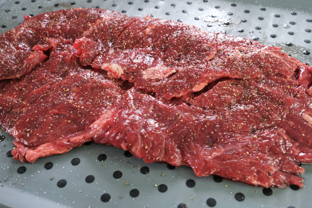 flap steak seasoned with salt and pepper