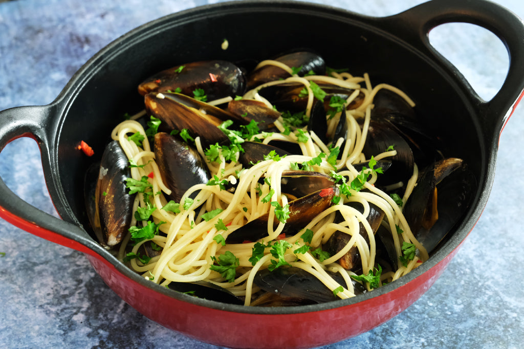 enameled cast iron balti dish with pasta vongole