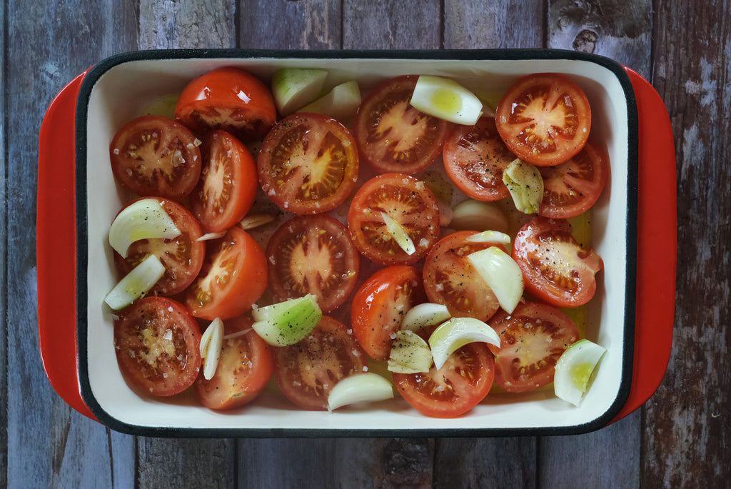 tomatoes in an enameled cast iron roasting pan