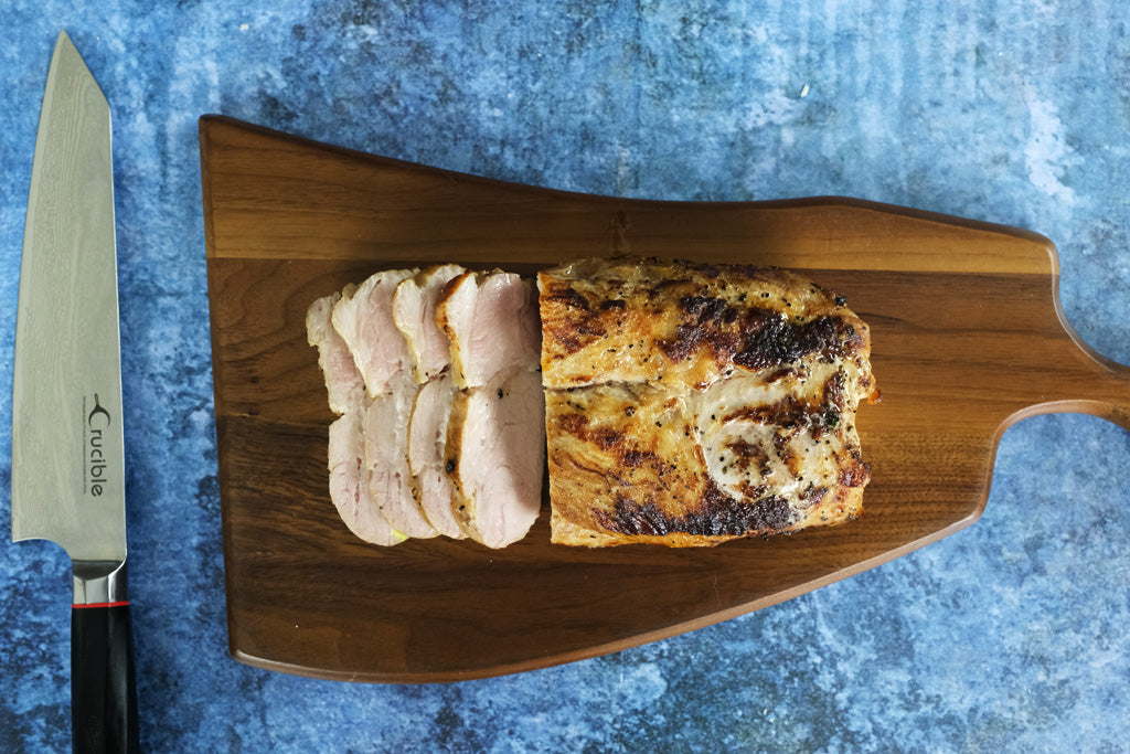 Pork Sirloin Roast sliced on a cutting board