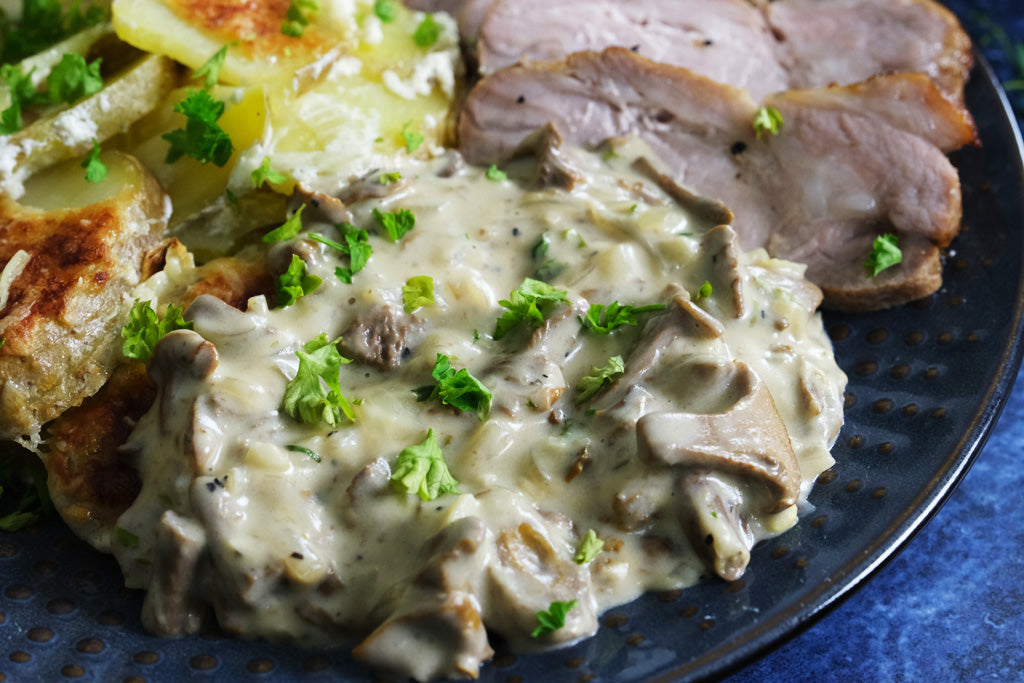 chanterelle sauce served with potato gratin and pork sirloin