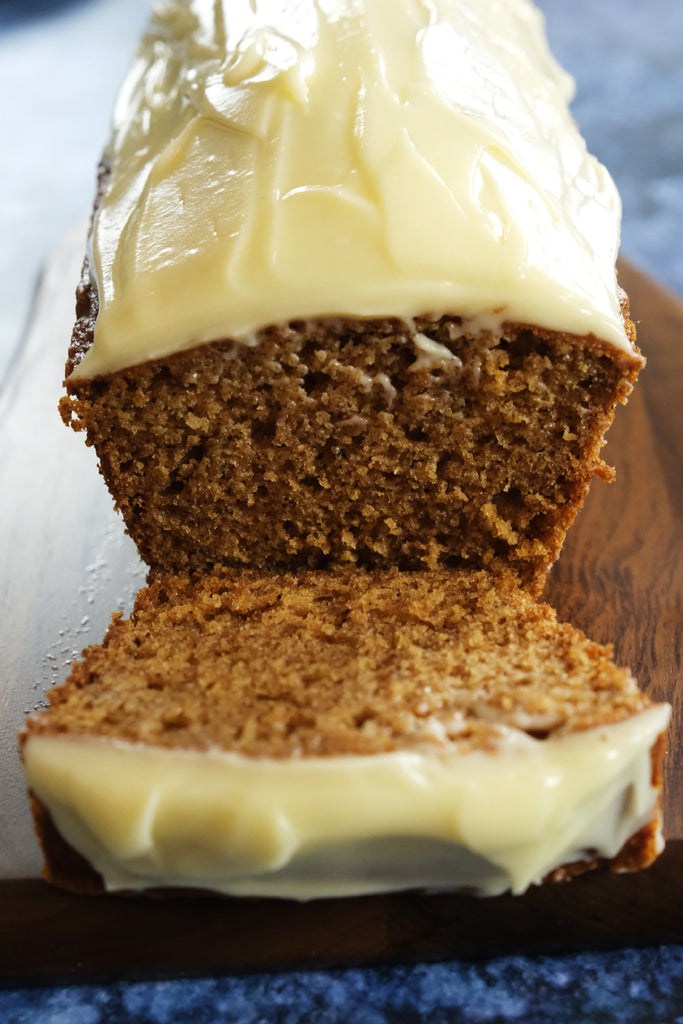 spice cake loaf with cream cheese frosting sliced