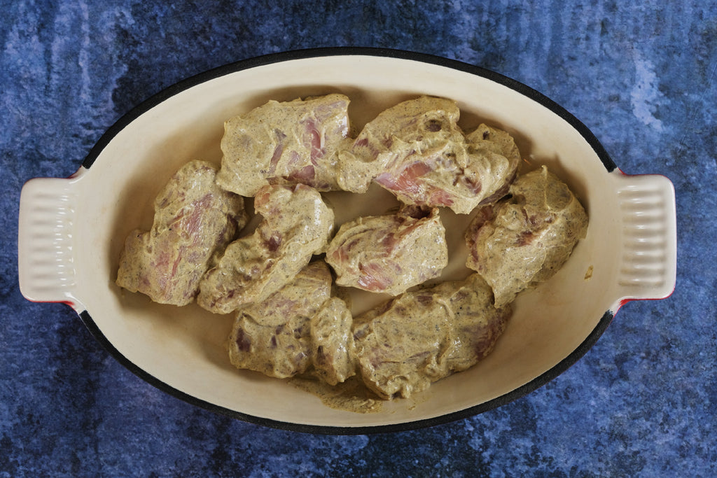 chicken in an enameled cast iron roasting pan