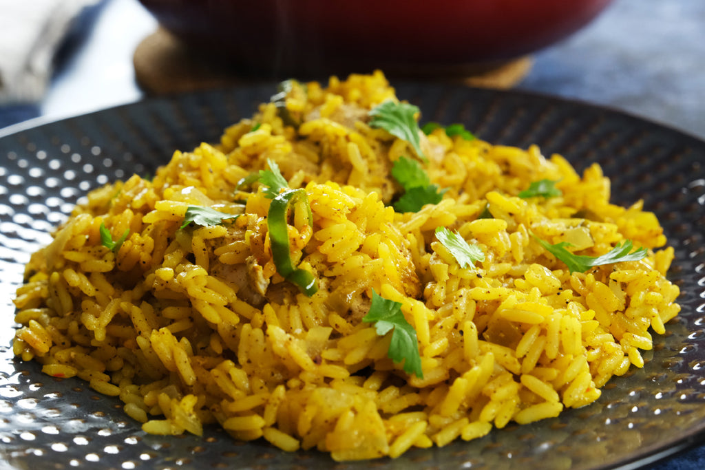 Biryani served topped with fresh coriander