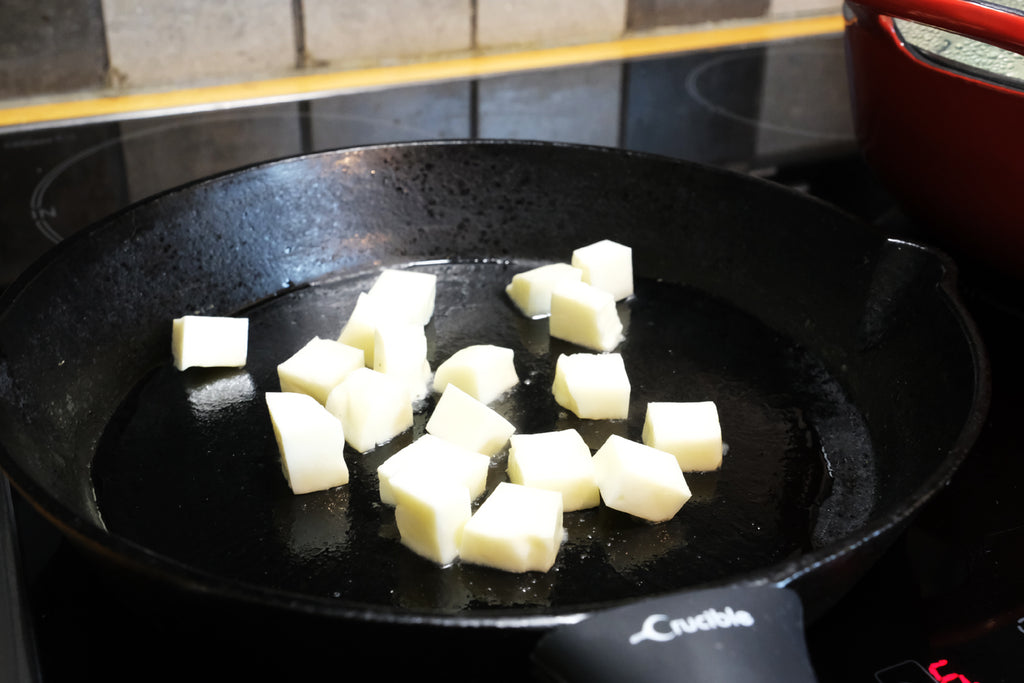 sauteing halloumi in a cast iron skillet