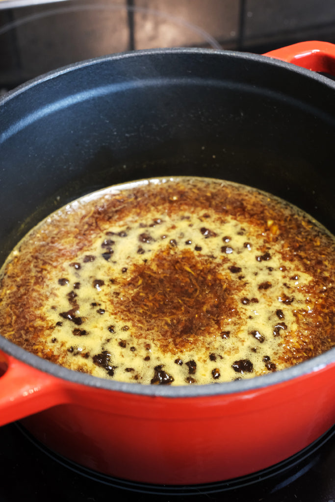 orange and ginger glaze in an enameled cast iron dutch oven