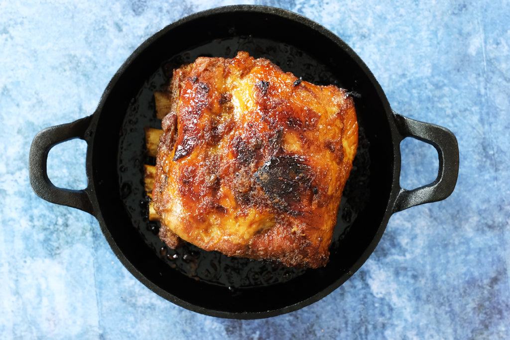 roasted pork ribs in a cast iron pan