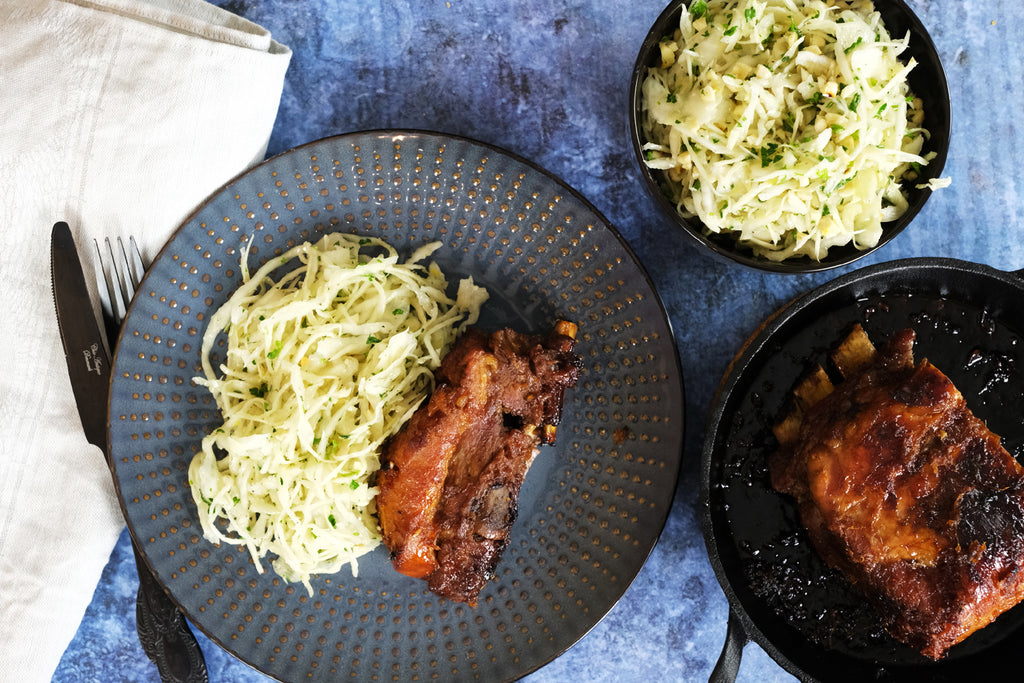 pork ribs with orange and ginger glaze served with cabbage salad