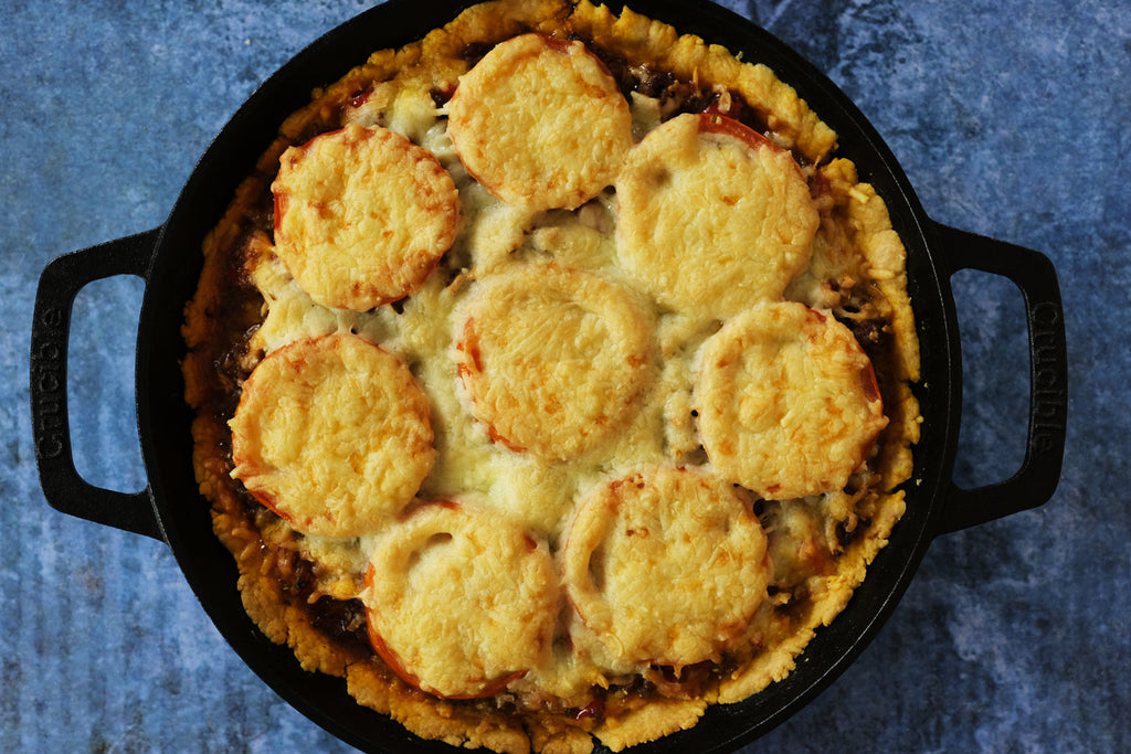 taco pie baked and reaty to be served in a 10.25" inch cast iron skillet with loop handles