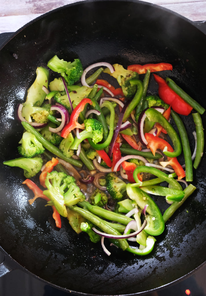 vegetables in a cast iron wok