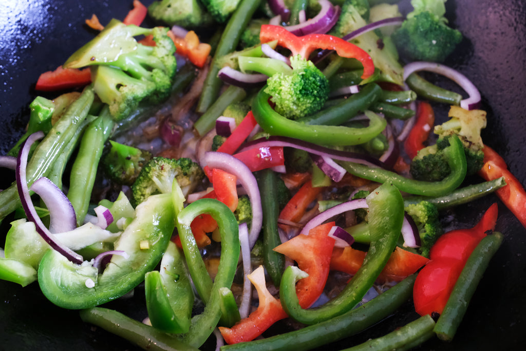 stir fry in a cast iron wok