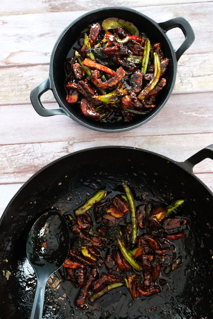 serving stir fry on a cast iron serving pan