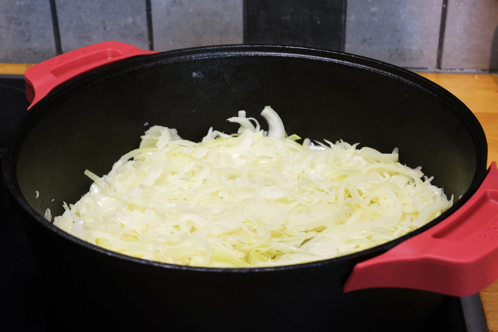 cabbage and onion in a 12" extra deep cast iron skillet with loop handles