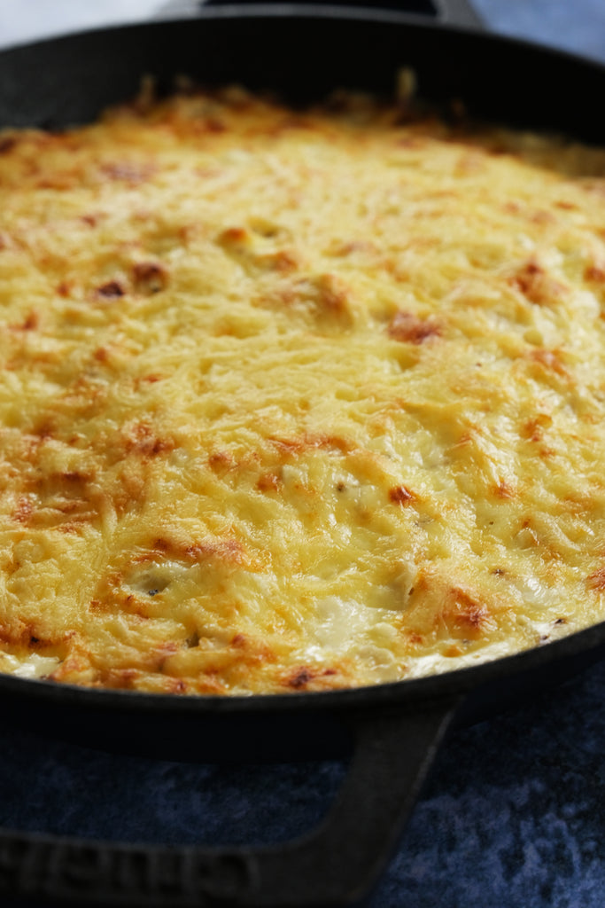 cabbage gratin in a crucible cookware cast iron skillet with loop handles