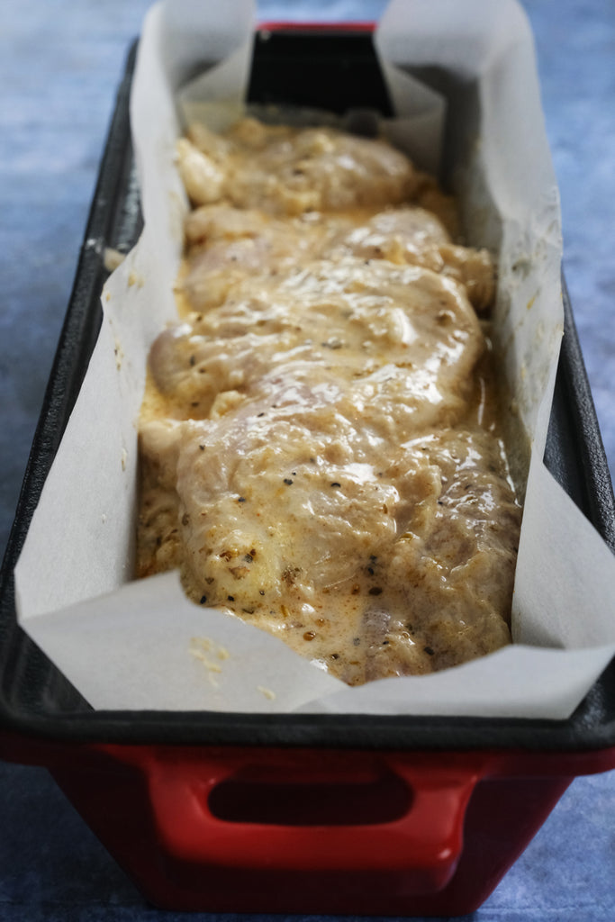 chicken gyros in an enameled cast iron bread pan