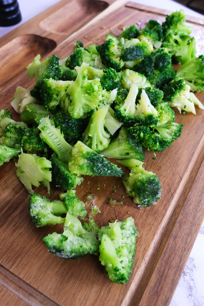 broccoli on a cutting board