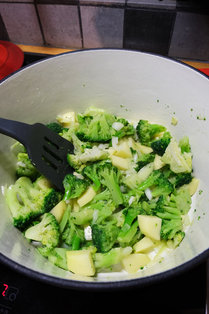 searing broccoli, onion, garlic and potatoes in an enameled cast iron dutch oven