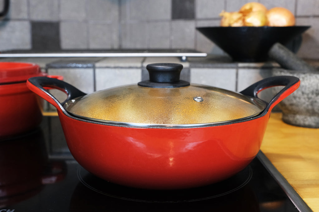 cooking maafe in an enamled cast iron balti dish with lid