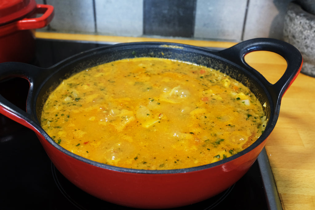 simmering maafe in an enameled cast iron balti dish
