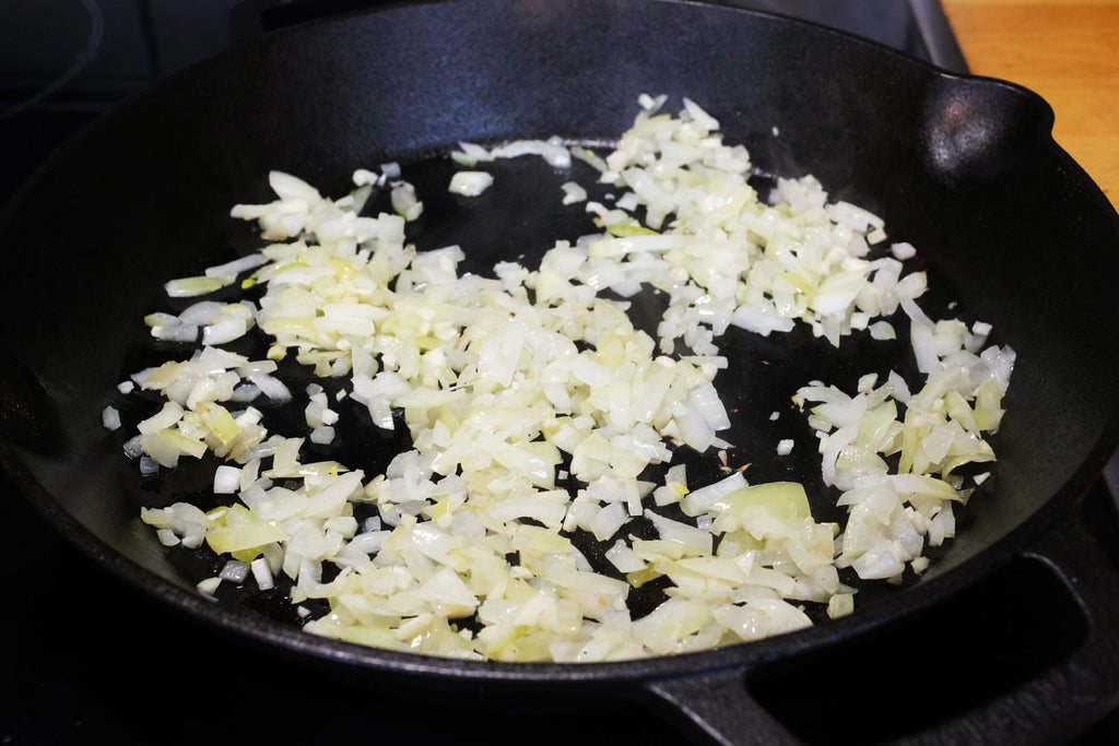 cooking onion in a cast iron skillet