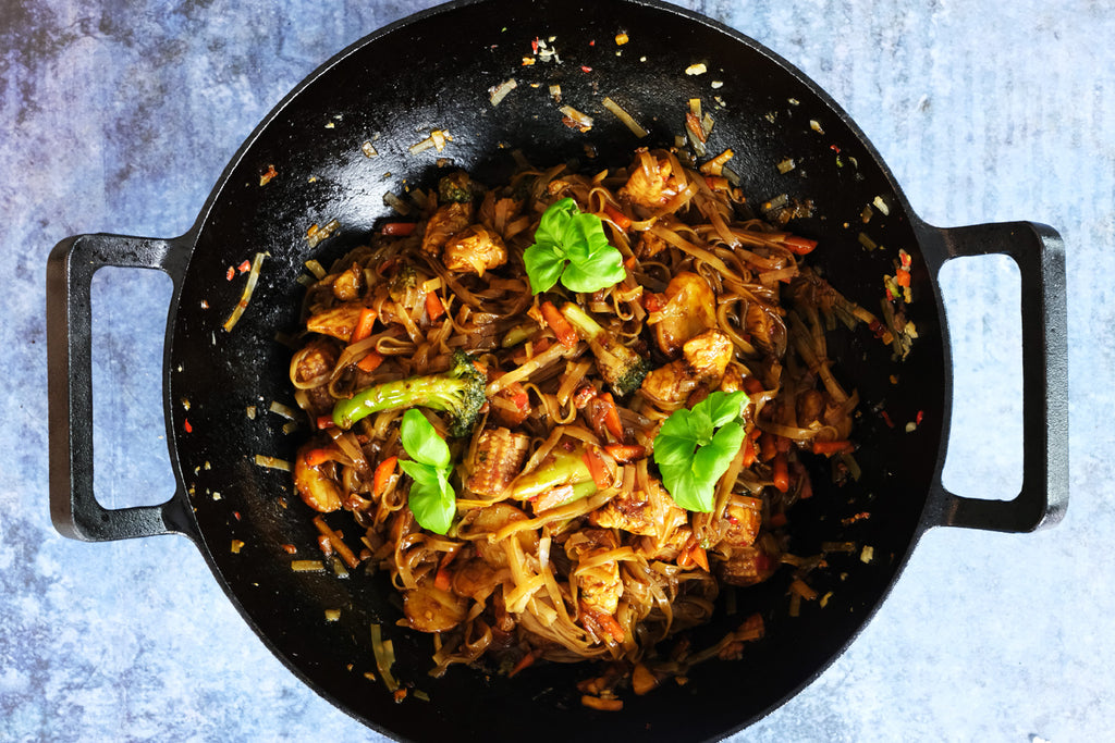 Drunken Noodles with Chicken in a Cast Iron Wok from above