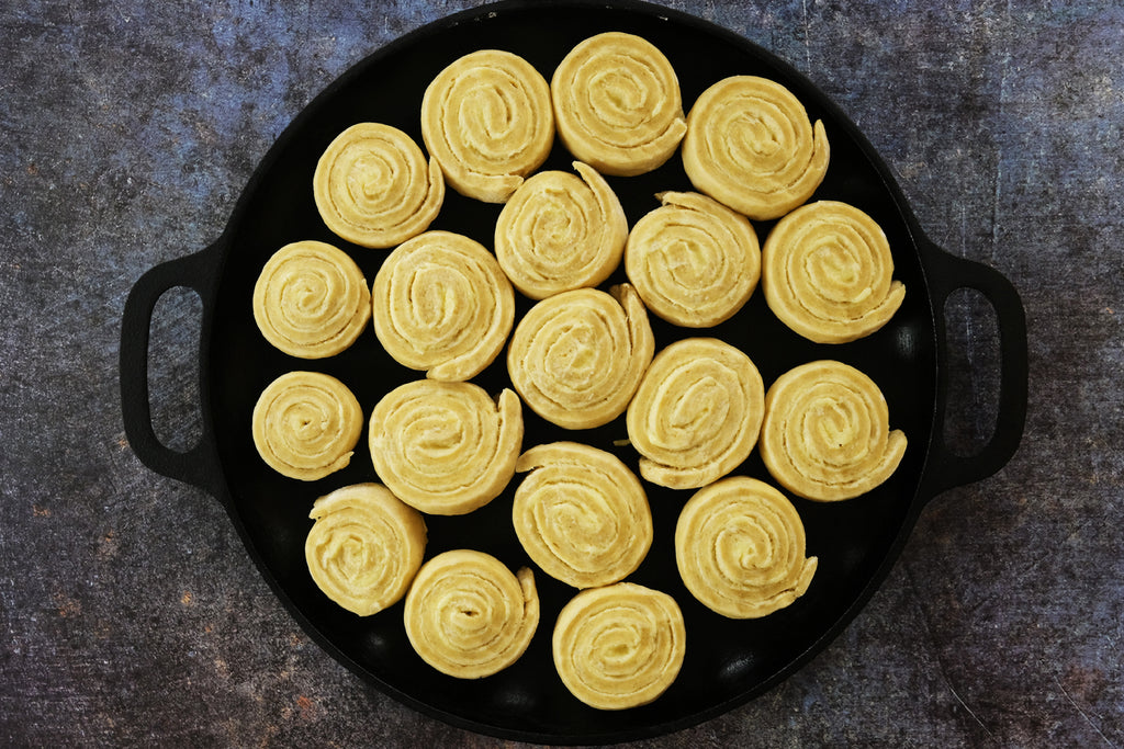 rolls on a cast iron pizza pan after resting