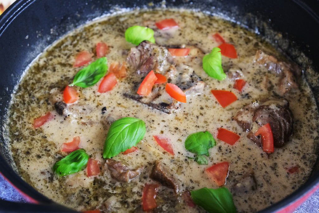 lamb stew in a cast iron balti dish