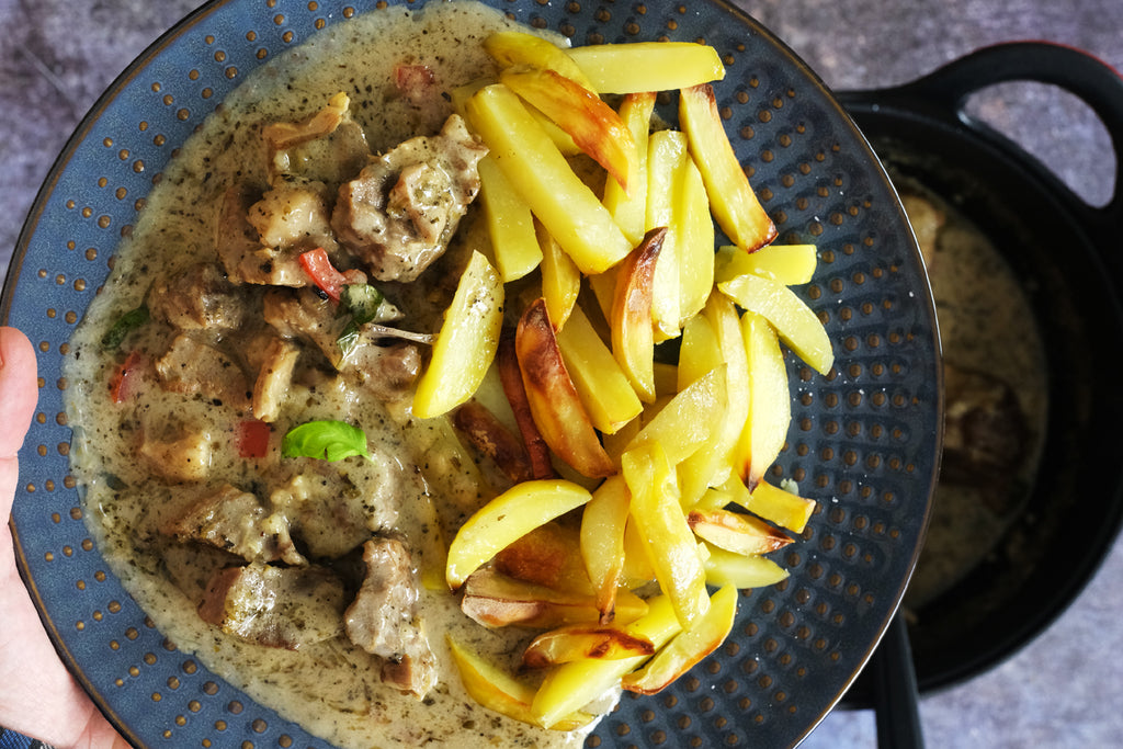 lamb stew served with potato wedges