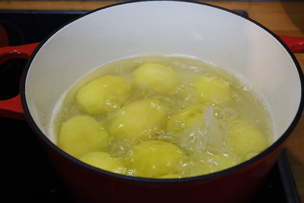 boiling potatoes in an enameled cast iron dutch oven