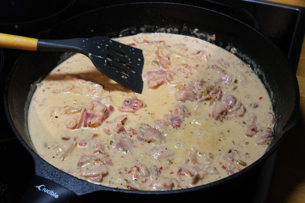 creamy ajvar and bacon sauce in a 12 inch cast iron skillet