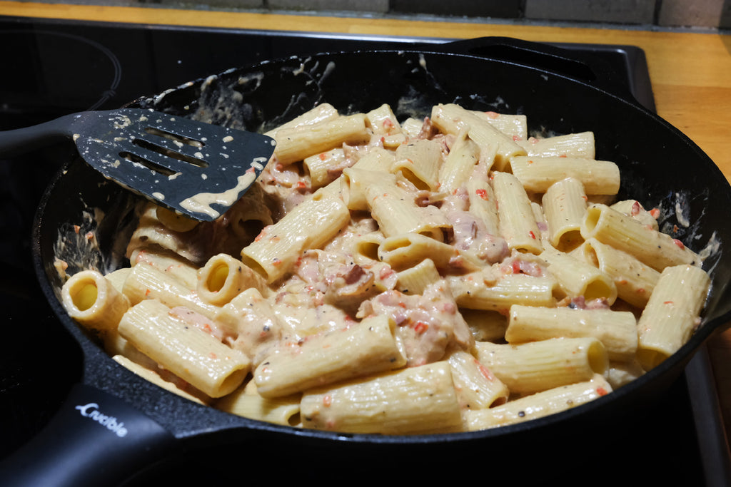 ajvar relish and bacon pasta in a 12" cast iron skillet